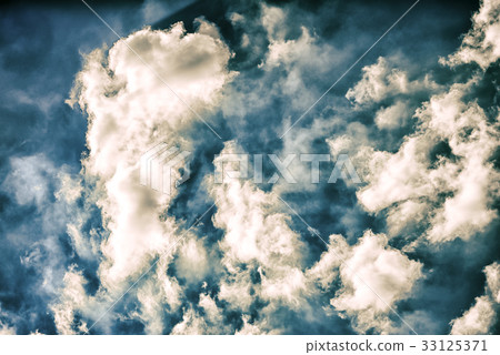 Blue sky with many fluffy white clouds close up 33125371