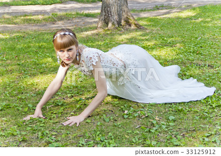 Beautiful bride in white lace dress of summer time 33125912
