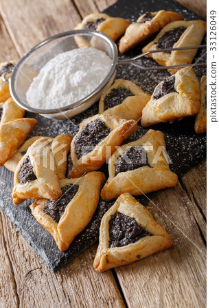 Hamentashen triangular cookies with poppy seed 33126049
