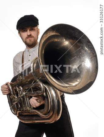 man with suspenders and cap holding the tube 33126177