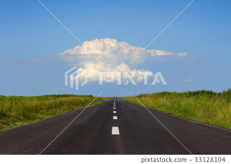 straight road with white cloud at the horizon 33128104