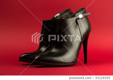 high heel black shoes on red background high heel black shoes on red background 33128105