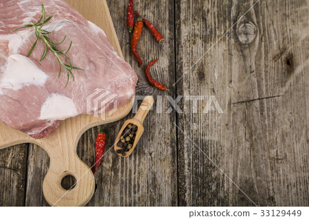 Raw pork on a wooden table Raw pork on a wooden table 33129449