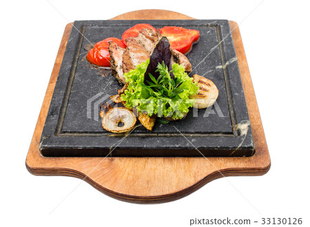 Grilled pork fillet with delicious vegetables. 33130126