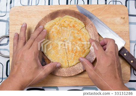 Chef prepared cooked Roti to the plate Chef prepared cooked Roti to the plate 33131286