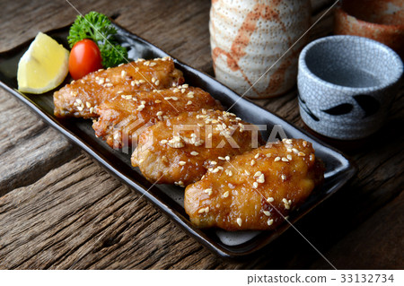 Fried chicken wing within Japanese tebasaki Fried chicken wing within Japanese tebasaki 33132734
