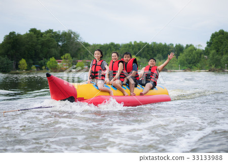 Asian family play banana boat Asian family play banana boat 33133988