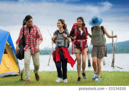 Asian friends walking in camping Asian friends walking in camping 33134200