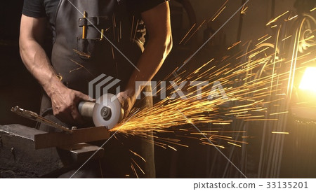 Sparks during cutting of metal angle grinder 33135201