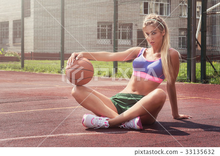 woman in sportswear with basketball ball 33135632