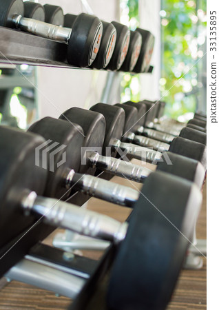 Rows of dumbbells in the modern gym 33135895