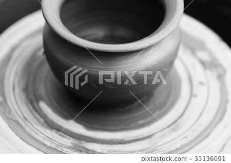 Potter making ceramic pot on the pottery wheel Potter making ceramic pot on the pottery wheel 33136091