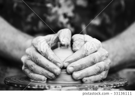 Potter making ceramic pot on the pottery wheel Potter making ceramic pot on the pottery wheel 33136111