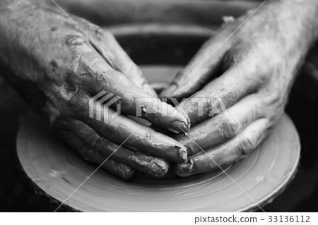 Potter making ceramic pot on the pottery wheel Potter making ceramic pot on the pottery wheel 33136112