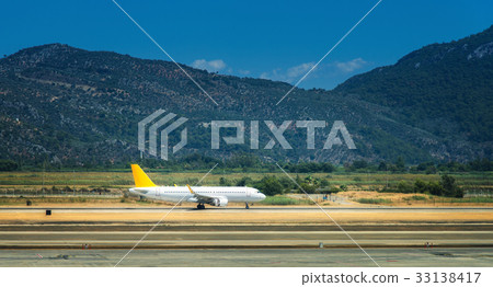 White airplane on the runway in Dalaman airport White airplane on the runway in Dalaman airport 33138417