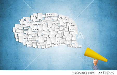 Hand of man holding red paper trumpet and speech cloud 33144829