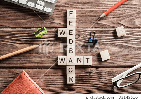 Conceptual media keywords on table with elements of game making crossword Conceptual media keywords on table with elements of game making crossword 33145510