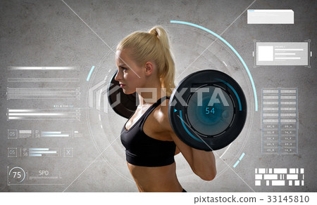 young sporty woman exercising with barbell 33145810