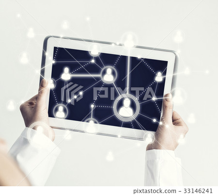 Close of female doctor hands working with tablet pc computer 33146241
