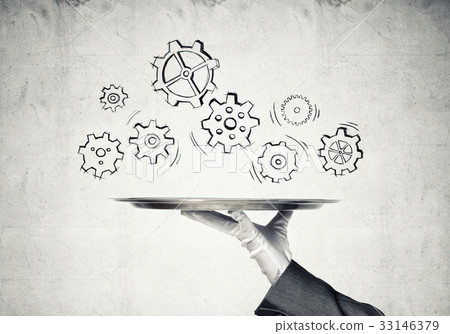 Waiter hand with empty silver tray and drawn gears concept Waiter hand with empty silver tray and drawn gears concept 33146379