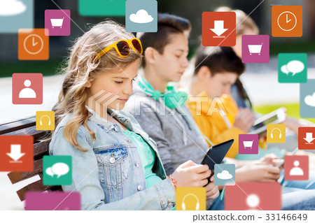 happy teenage friends with tablet pc outdoors 33146649