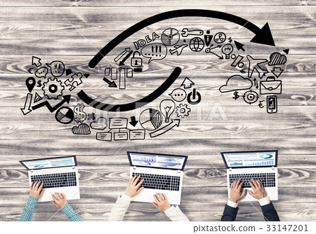 Top view of businesspeople sitting at table and using gadgets Top view of businesspeople sitting at table and using gadgets 33147201