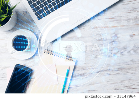 Business workplace with laptop coffee cup and security concept on screen 33147964
