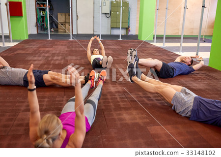 group of people exercising in gym 33148102