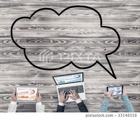 Top view of businesspeople sitting at table and using gadgets Top view of businesspeople sitting at table and using gadgets 33148319