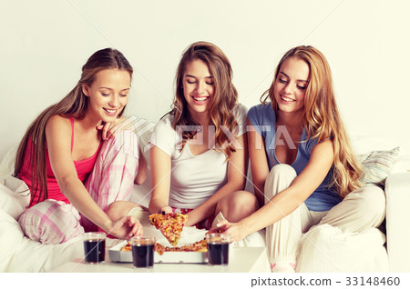 happy friends or teen girls eating pizza at home 33148460