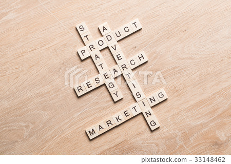 Conceptual business keywords on table with elements of game making crossword 33148462