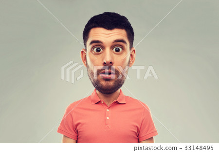 surprised man in polo t-shirt over gray background surprised man in polo t-shirt over gray background 33148495