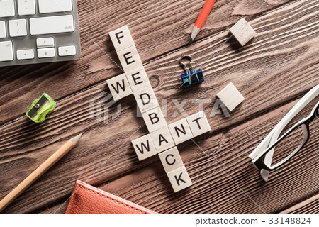 Conceptual media keywords on table with elements of game making crossword 33148824