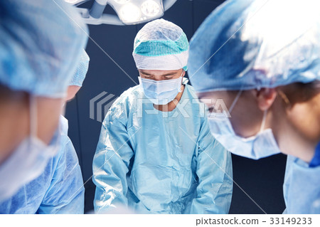 group of surgeons in operating room at hospital 33149233
