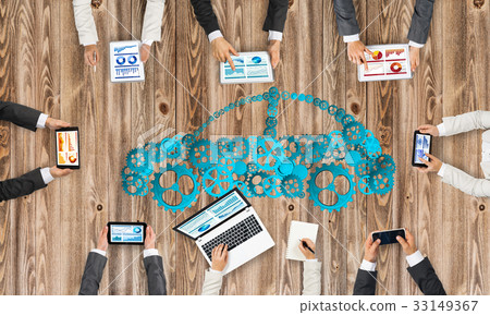 Top view of businesspeople sitting at table and using gadgets 33149367