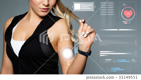 close up of sporty woman with fitness tracker close up of sporty woman with fitness tracker 33149551