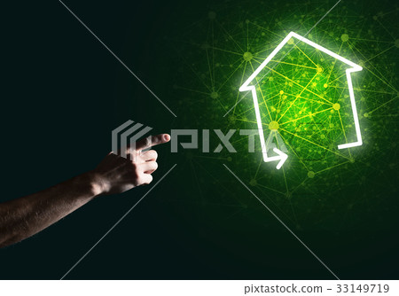 Conceptual image with hand pointing at house or main page icon on dark background 33149719
