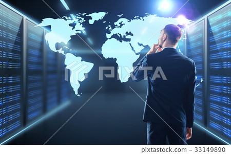 businessman with world map projection in corridor businessman with world map projection in corridor 33149890