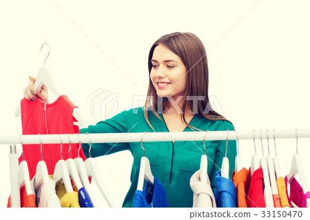 happy woman choosing clothes at home wardrobe happy woman choosing clothes at home wardrobe 33150470
