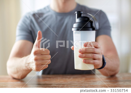 man with protein food showing thumbs up man with protein food showing thumbs up 33150754