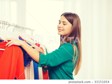 happy woman choosing clothes at home wardrobe happy woman choosing clothes at home wardrobe 33151054