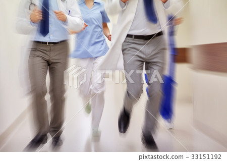close up of medics or doctors running at hospital close up of medics or doctors running at hospital 33151192