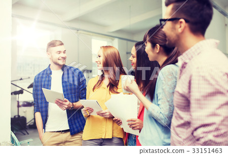 creative team on coffee break talking at office 33151463