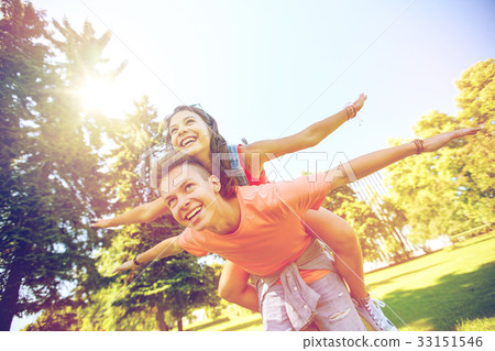 happy teenage couple having fun at summer park happy teenage couple having fun at summer park 33151546