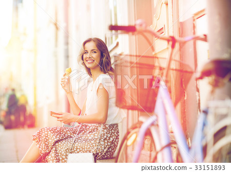 happy woman with smartphone, bike and ice cream 33151893
