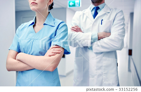close up of doctor and nurse at hospital corridor 33152256