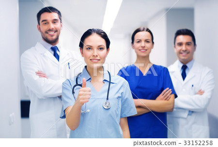 medics or doctors at hospital showing thumbs up medics or doctors at hospital showing thumbs up 33152258