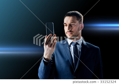 businessman with transparent smartphone businessman with transparent smartphone 33152324
