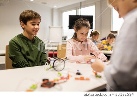happy children building robots at robotics school happy children building robots at robotics school 33152554