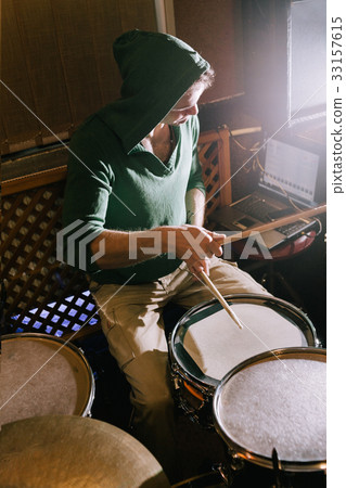 Drummer recording drums in music studio Drummer recording drums in music studio 33157615